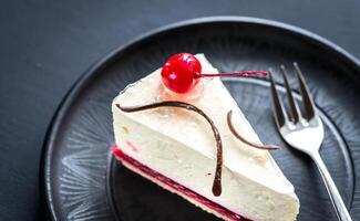 Raspberry cheesecake with sweet cherry photo