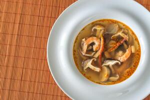 Portion of thai tom yum soup photo