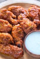 Fried chicken wings with blue cheese sauce photo