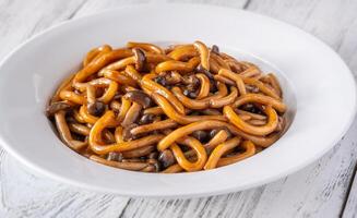 Udon noodles with mushrooms photo