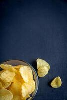 Potato chips in the glass bowl photo