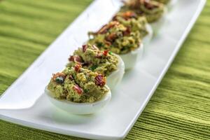 Bacon guacamole deviled eggs photo