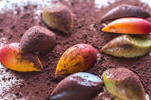 Luxury chocolate candies with cocoa powder photo