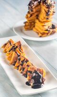 Pumpkin pancakes with chocolate topping photo