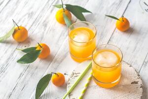 Two glasses of orange juice photo
