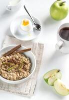 Oats with egg and green apple photo