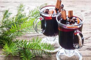 Two glasses of mulled wine with fir branch photo