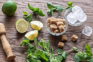 Ingredients for mojito on the wooden background photo