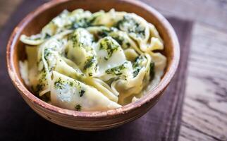 Tortellini with ricotta and spinach under mint sauce photo