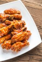 Portion of buffalo chicken wings photo