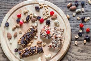 Granola bars with dried berries and chocolate photo