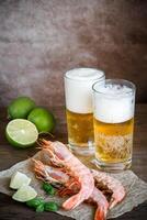 Shrimps with glasses of beer photo