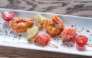 Skewers with shrimps and salmon photo