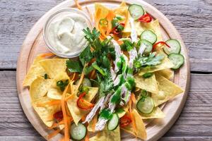 Nachos with chicken and vegetables photo