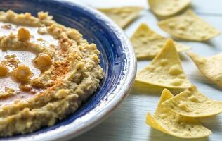 Hummus with tortilla chips photo