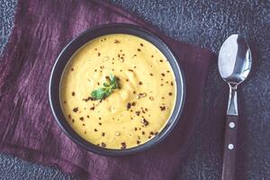 Bowl of lentil coconut creamy soup photo