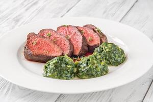 Flank steak with creamy spinach photo