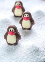 Chocolate candies in the shape of penguins photo