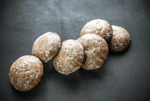 Gingerbread cakes on the wooden background photo