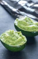 Guacamole in avocado shells photo