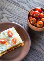 Lasagna with cherry tomatoes photo