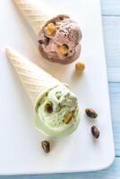 Two cones of nut-flavored ice cream photo