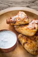 Fried chicken wings with sauce photo