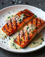 AI generated Slices of grilled salmon with creamy mustard chive sauce sprinkled with pepper on a white plate photo