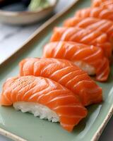 AI generated Salmon sushi is neatly arranged on a light green plate, The table used is white table top photo