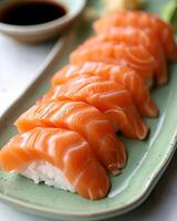 AI generated Salmon sushi is neatly arranged on a light green plate, The table used is white table top photo