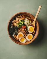 AI generated Ramen in aesthetic wooden bowl on clean green background, delicious japanese food photo