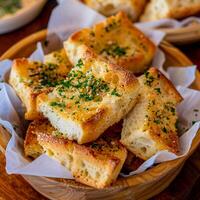 AI generated Several pieces of Italian garlic bread on greaseproof paper in a wooden bowl photo