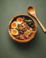 AI generated Ramen in aesthetic wooden bowl on clean green background, delicious japanese food photo