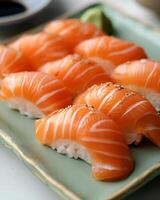 AI generated Salmon sushi is neatly arranged on a light green plate, The table used is white table top photo