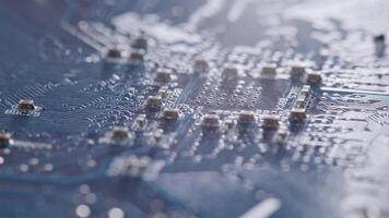 Computer electronic circuit board with radial conductor tracks and SMD capacitors rotating macro video