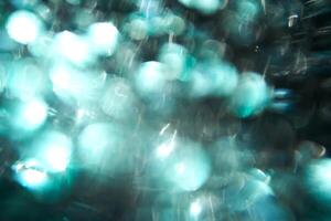 Christmas abstract background made of emerald green sequins. photo