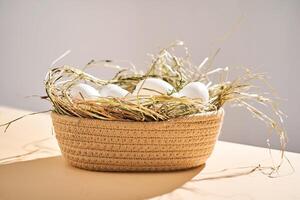 Wicker basket with farm natural white eggs. photo