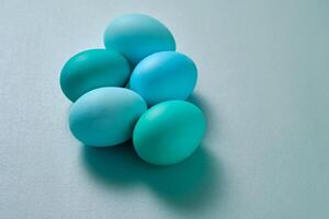 Blue Easter eggs on a blue background. photo