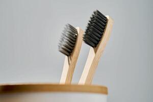 Toothbrushes in a glass. Daily morning routine. photo