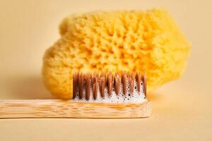 Toothbrush with toothpaste foam close-up. photo