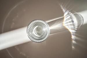 A glass of clean drinking water in the morning sun. photo