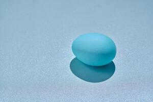 Blue Easter egg on a blue background. photo