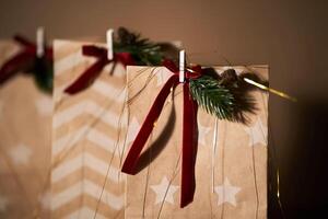 Christmas gift bags with decor and Christmas ornament. photo