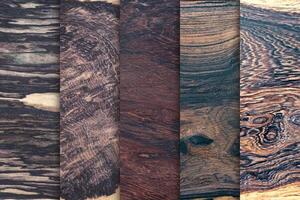 Set of natural real black white ebony wood planks with groove joints have a vertical background photo