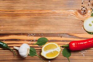 Cooking table. Background with spices and vegetables. Top view. Free space for your text. photo