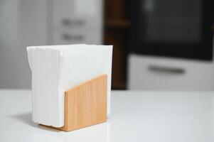 Wooden napkin holder in kitchen photo