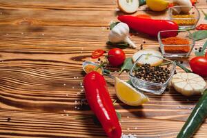 Cooking table. Background with spices and vegetables. Top view. Free space for your text. photo