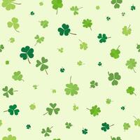 St Patrick Day irregular seamless pattern green clover leaves isolated on light green background vector