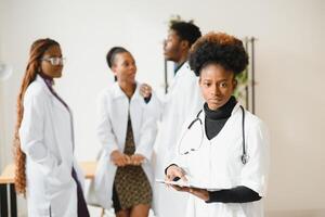 Portrait of a friendly black female doctor. photo