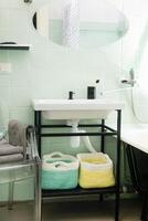 Budget bathroom interior in bright colors. Details of the bathroom interior. photo